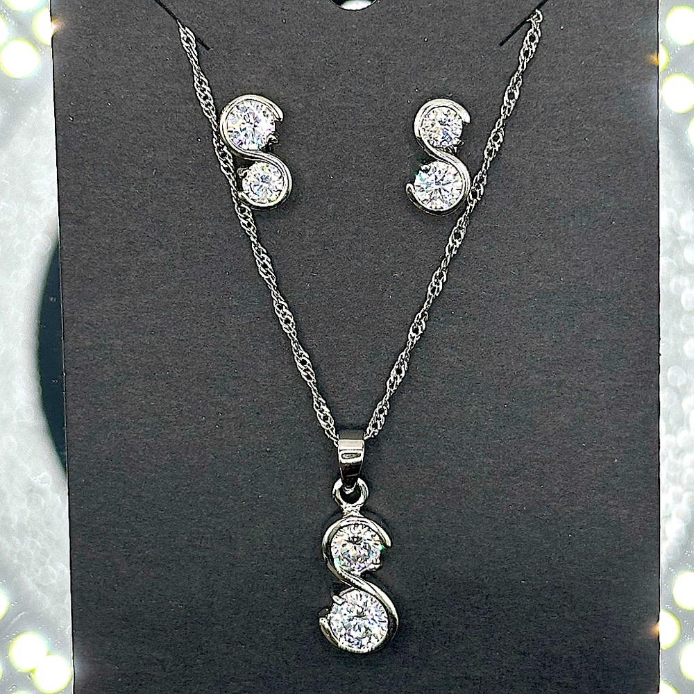 Brilliant cut Moissanite diamonds set in sterling silver S settings